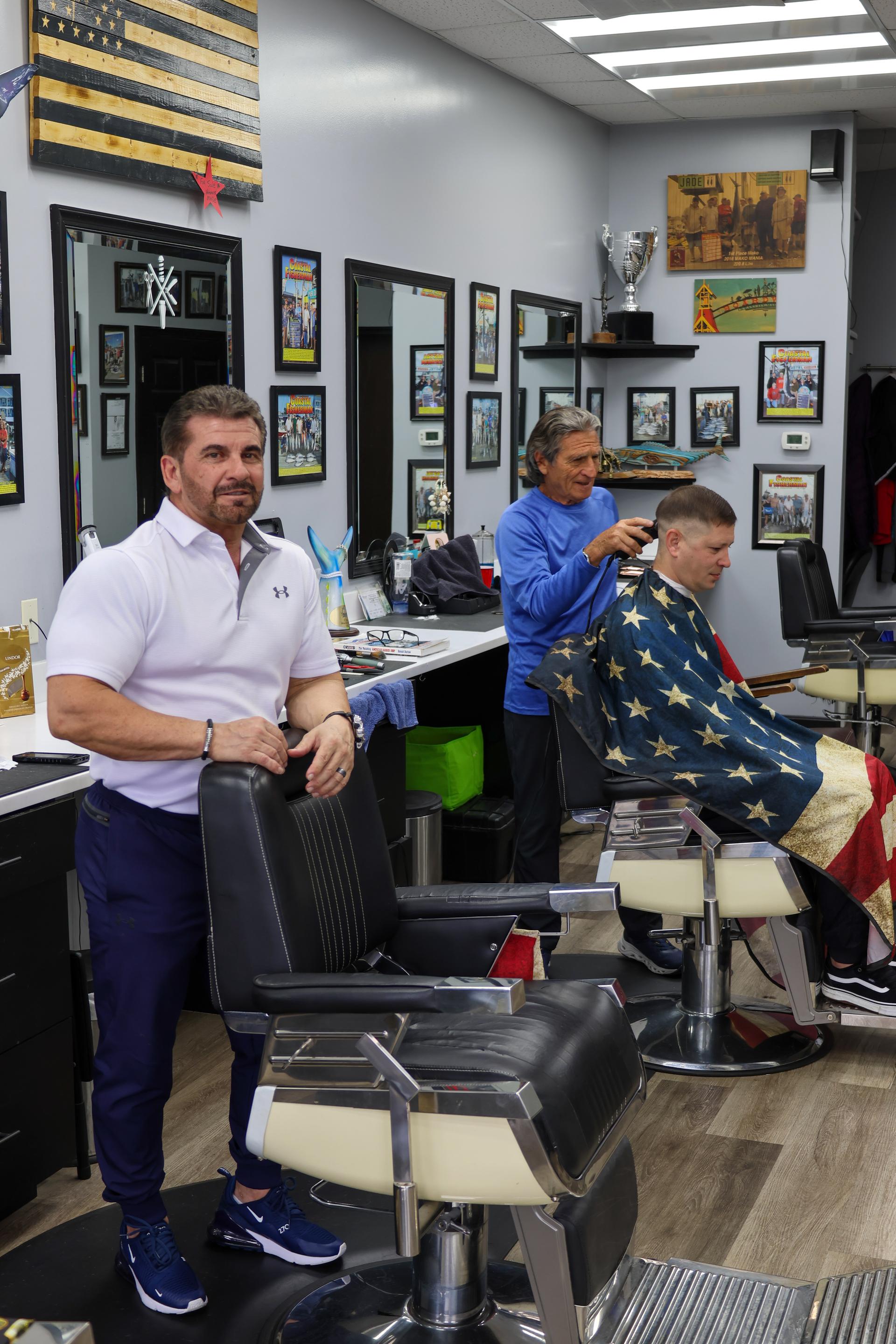 Inside Olde Tyme Family Barber Shop — barbers at work in the Ocean City, MD shop