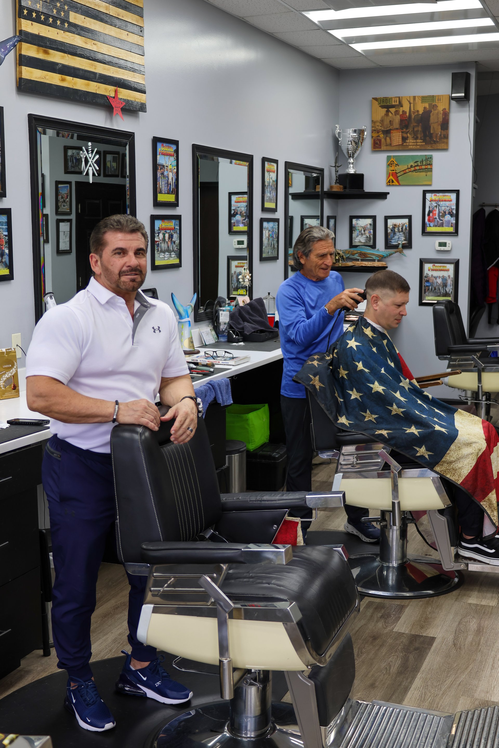 Inside Olde Tyme Family Barber Shop — barbers at work in the Ocean City, MD shop